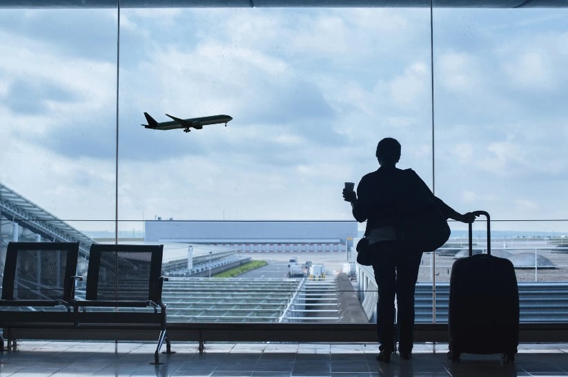 A women in the airport considering Air Canada's approach and how it provides key lessons in change management