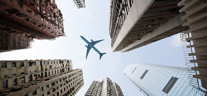 Aeroplane flying over Corporate buildings 