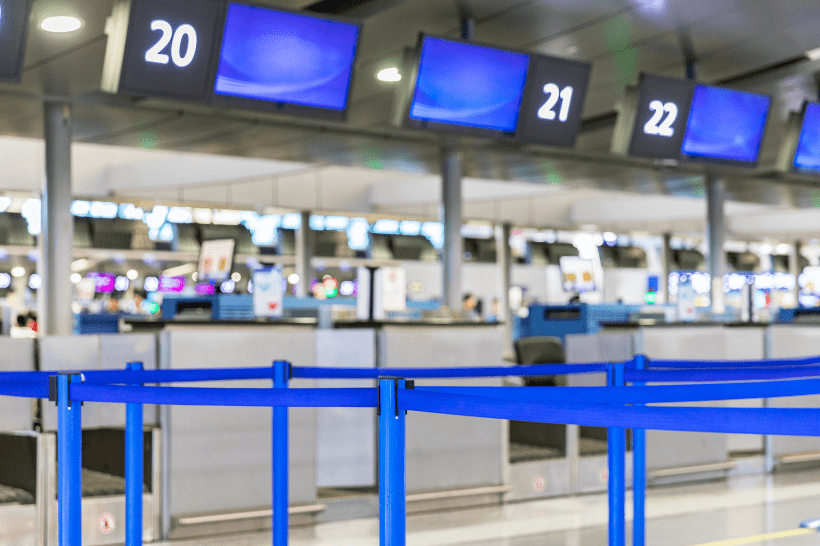 An airport check in desk where colleagues may need to use traveler tracking 