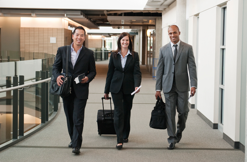 Three colleagues going on a business trip for company culture and growth